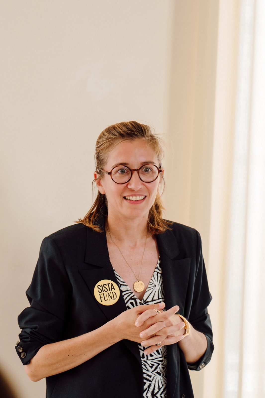 Marie speaking at a SISTAFUND gathering